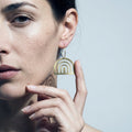 Statement Earrings — On Model - Jewelry Hands Detail | Generated by Modelize